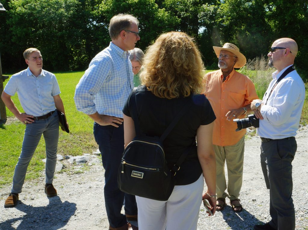 Princeville, N.C., Commissioner Milton Bullock (orange shirt) gives HMDRRI staff and students a tour of Hurricane Matthew-impacted areas of the town. Photo by Jessica Southwell.