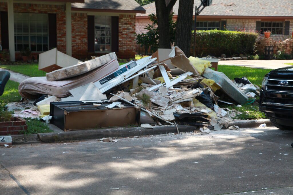 Debris on the side of the road in a Houston area neighborhood affected by Hurricane Harvey. Photo courtesy of FEMA.