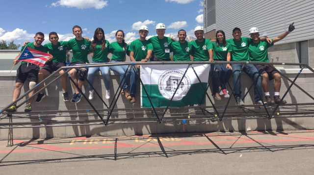 Students from UPR-M pose with their steel bridge from the national competition.