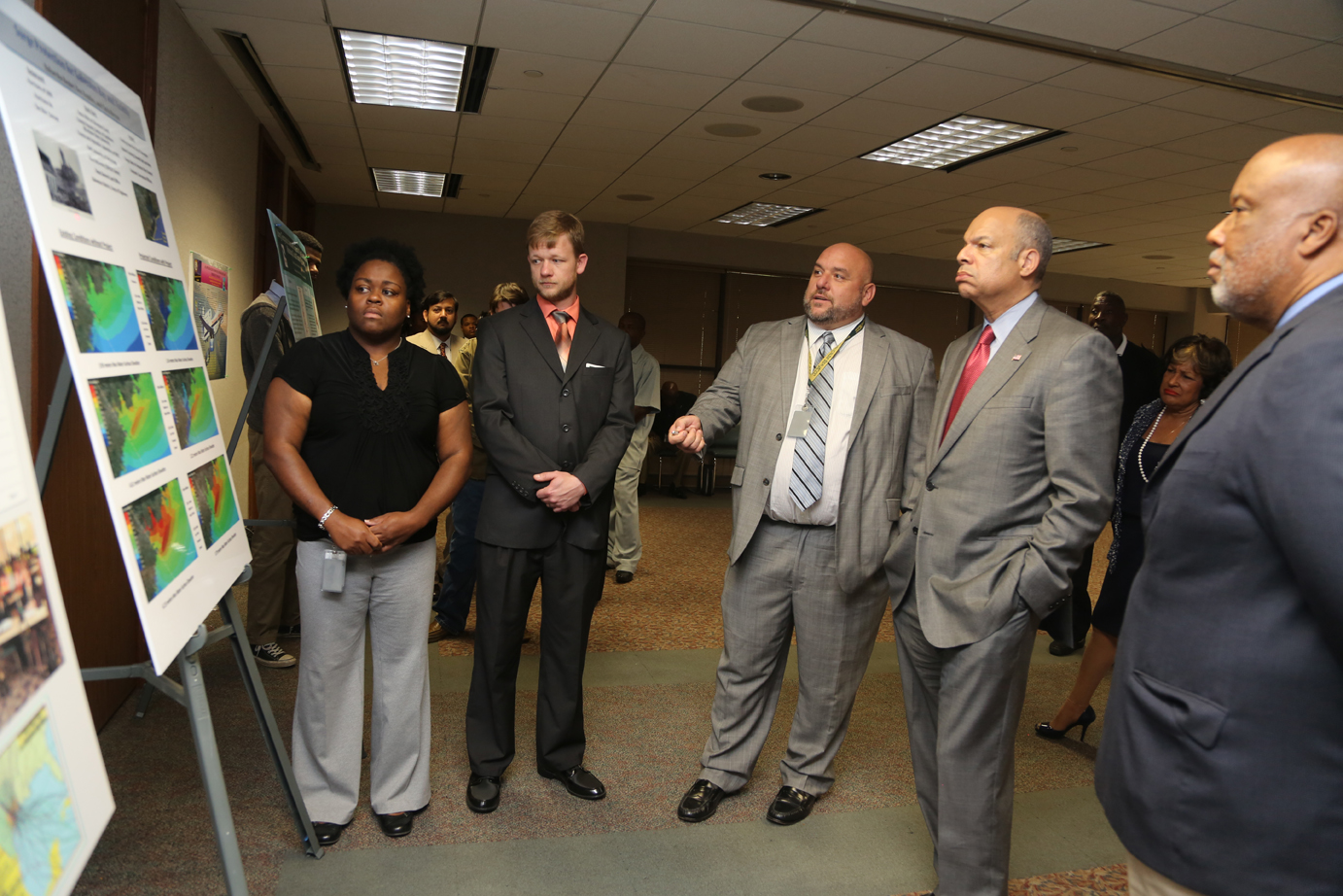 From left: Nakarsha Bester, Donald Hendon and Chris Herron explain storm surge scenarios to former Department of Homeland Security Secretary Jeh Johnson, Secretary and U.S. Rep. Bennie Thompson of Mississippi's 2nd District, at Jackson State University. Bester, Hendon and Herron all received master's degrees in Engineering (Coastal Engineering concentration) as part of the JSU program.