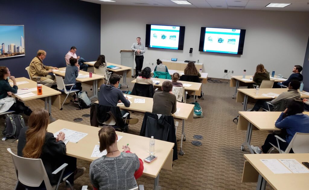 Trautman explained the county’s buyout program to students, largely from the University of North Carolina at Chapel Hill, who learned about the city-county’s flood buyout program, mitigation and retrofit efforts. Photo by Josh Kastrinsky.