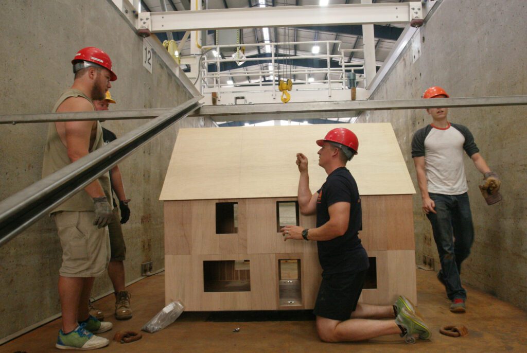 CRC researchers from Oregon State University, along with OSU students and University of Puerto Rico-Mayagüez students taking part in the SUMREX exchange program, test the strength of a model structure in the OH Hinsdale Wave Research Laboratory in the summer of 2018. Students from UPRM will return there this summer. Photo submitted.