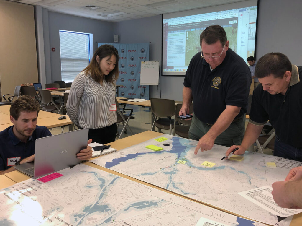 Representatives of Rhode Island emergency management agencies, along with government and public health departments met with University of Rhode Island researchers for training exercises this summer. Photo submitted.