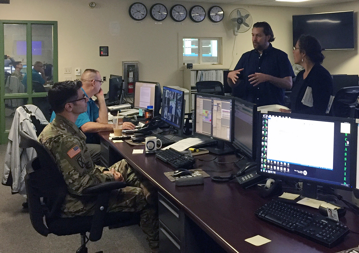 Pam Rubinoff, right, and Dr. Austin Becker, second from right, instruct participants in a June training on preparation for “Hurricane Rhody.” Photo via the University of Rhode Island.